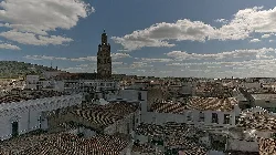 Panoramic view of Llerena with church and bell tower in the center.