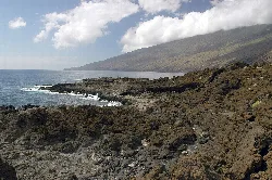 Rocky coast with sea and mountain in El Pinar de El Hierro.