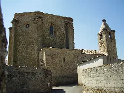Stone church with tower and bell tower in Torrequemada