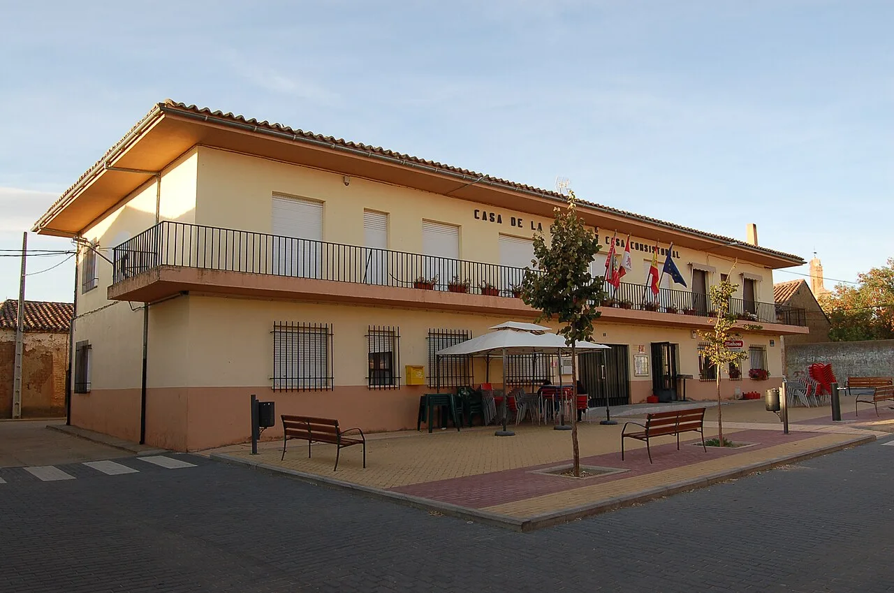 Town hall with balcony and flags in Manganeses de la Lampreana.