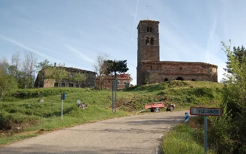 Vizcaínos church with bell tower and rural buildings in Burgos.