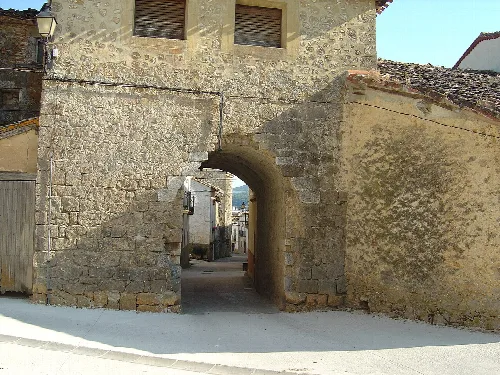 Stone archway on the main street of Zúñiga, Navarra.