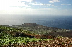 Coastal landscape with lighthouse and volcanic land on El Hierro.