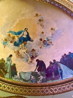 Mural with celestial and human figures in a church in Porcuna.