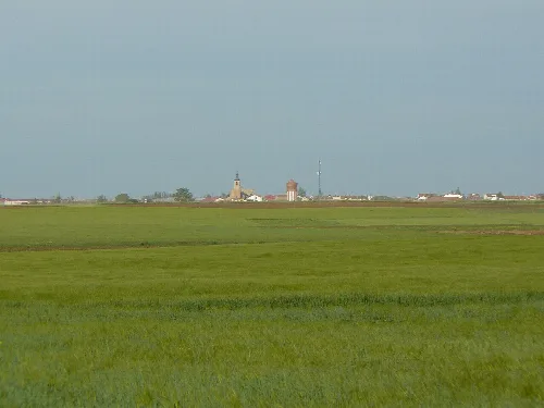 Rural landscape with church and buildings in Villarramiel, Palencia.