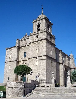 Church of San Sebastián with stone tower and façade in Villacastín.