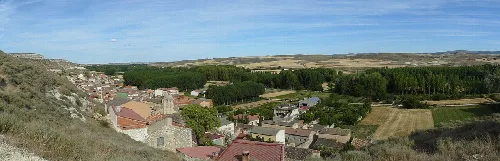 Panoramic view of houses and fields in Torregalindo, Burgos.