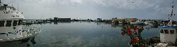 Adra port with boats and calm water.
