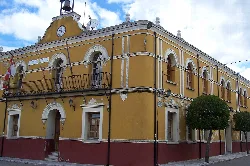 Matapozuelos town hall with clock and balconies.