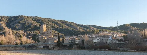 Panoramic view of Biel with buildings and mountains.