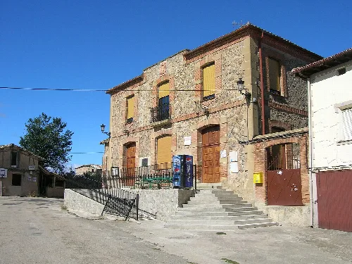 Old stone building with steps and street lamps in Viloria de Rioja.