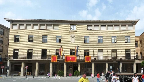 Tauste town hall building with flags on the facade.