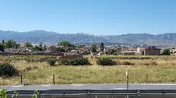 Panoramic view of La Torre with fields and mountains.