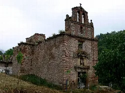 Ruins of San Juan church in Pedroso, La Rioja, with facade and bell tower in ruins.