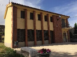 Building with brick facade and windows at the old school.