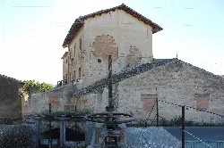 Flour mill building with a mill in the foreground in Mollerussa.