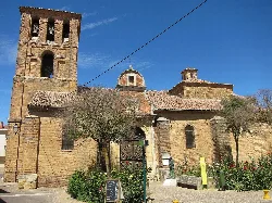 San Pedro Church in Saldaña with tower and façade on a sunny day.