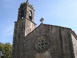 Church facade with tower and rose window on the wall