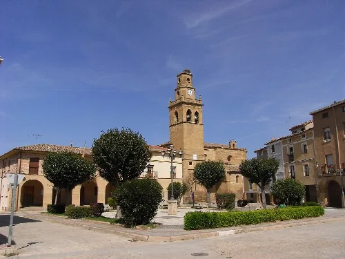 San Martin Church and square with trees and buildings in Anguciana.