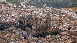 Aerial view of Jaén Cathedral with its towers and detailed facade.