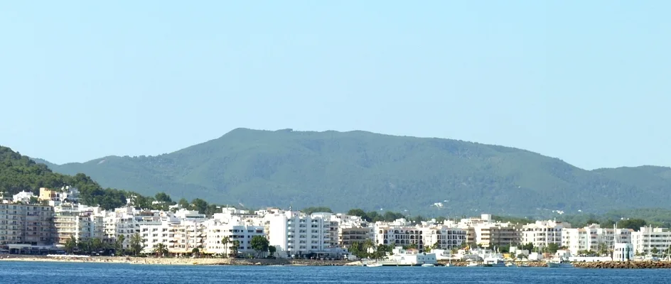 Panoramic view of Santa Eulària des Riu with buildings and mountains.