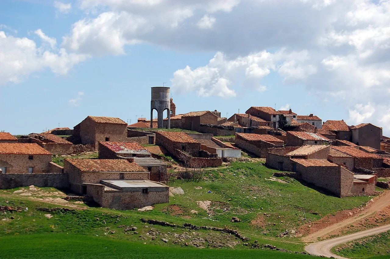 View of stone houses and a tower in Malanquilla, Zaragoza.