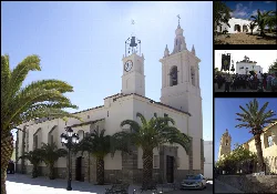 Church with two towers and palm trees in the foreground in Medina de las Torres.