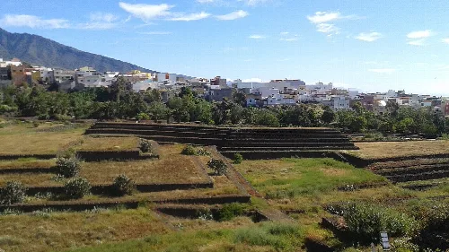 Pyramids of Güímar with terraces and hills in the background.