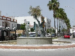 Fountain with statues at the Glorieta de la Unión in Los Palacios y Villafranca.