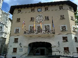 Town hall building with flags on the facade in Sóller.