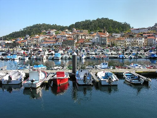 Harbor with boats and houses in Muros, Galicia.
