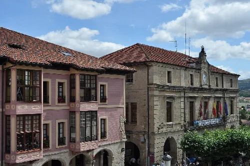 Historic buildings in Medina de Pomar, with classic and colorful facades.
