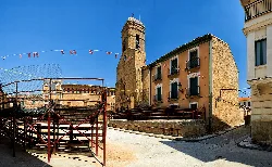 Square with tower and buildings in Carcastillo, Navarra.