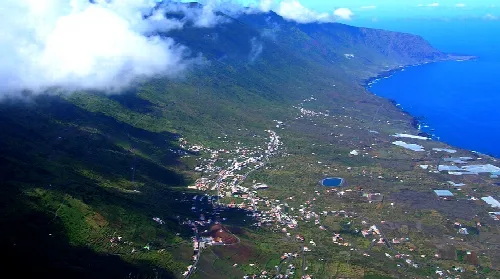 Aerial view of a valley with mountains and coast in El Hierro.