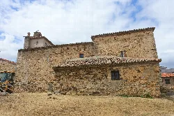 San Sebastián Church with stone walls and tiled roof in El Ordial.