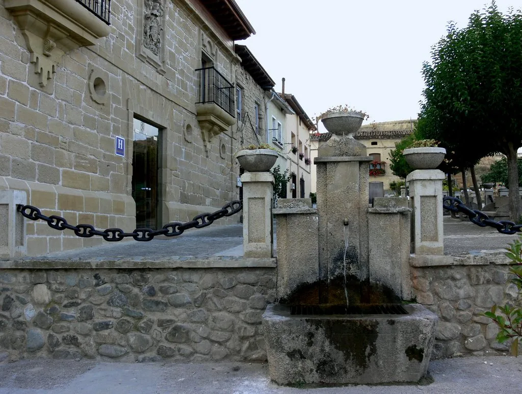Stone fountain and houses in Villalobar de Rioja.