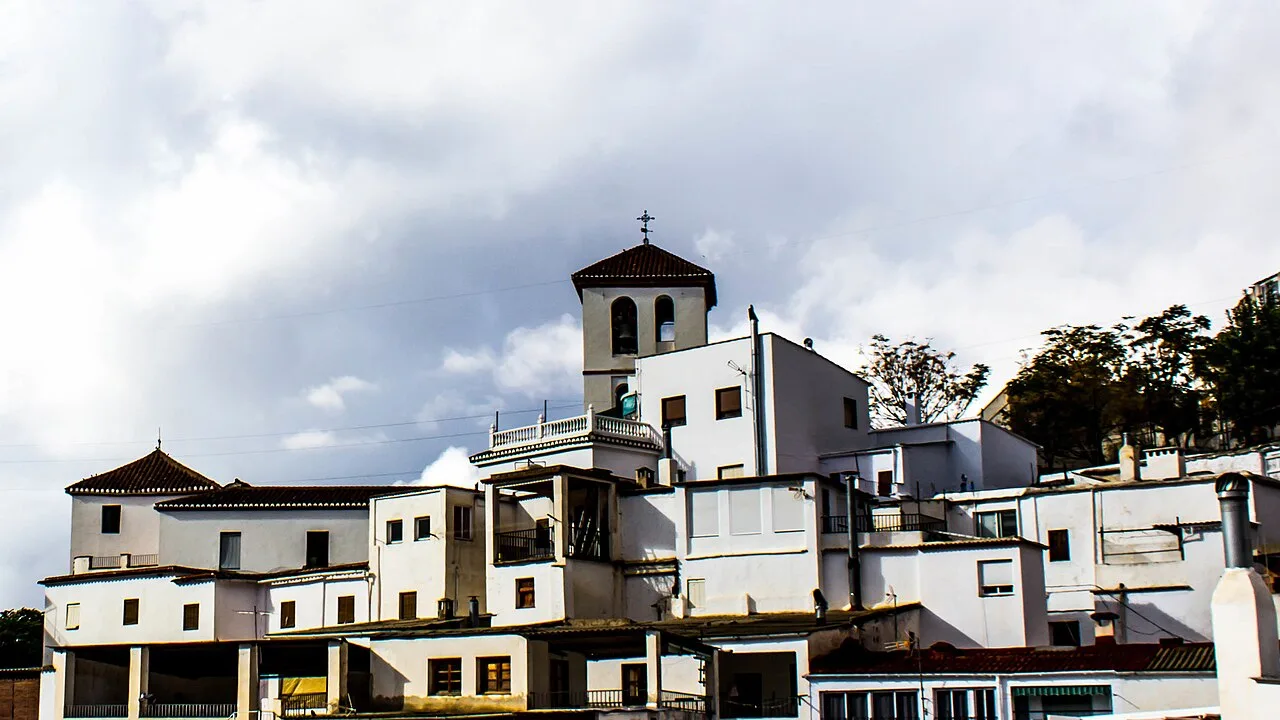 White houses and a church in the Iglesia neighborhood in Torvizcón.