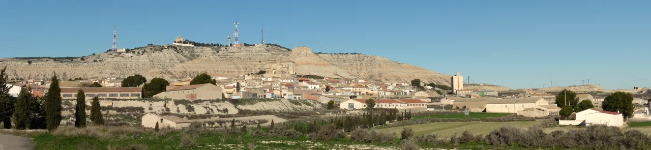 Panoramic view of La Almolda from the cemetery with hills and buildings.
