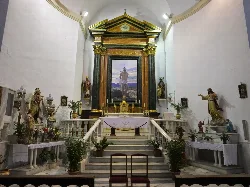 View of the main altar with painting and sculptures in San Sebastián church, Olula del Río.