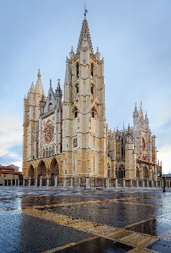 Gothic cathedral tower and facade with ornate details in León.
