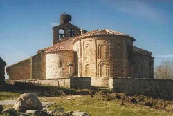 Stone church with tower and dome in Narros del Puerto, Ávila.