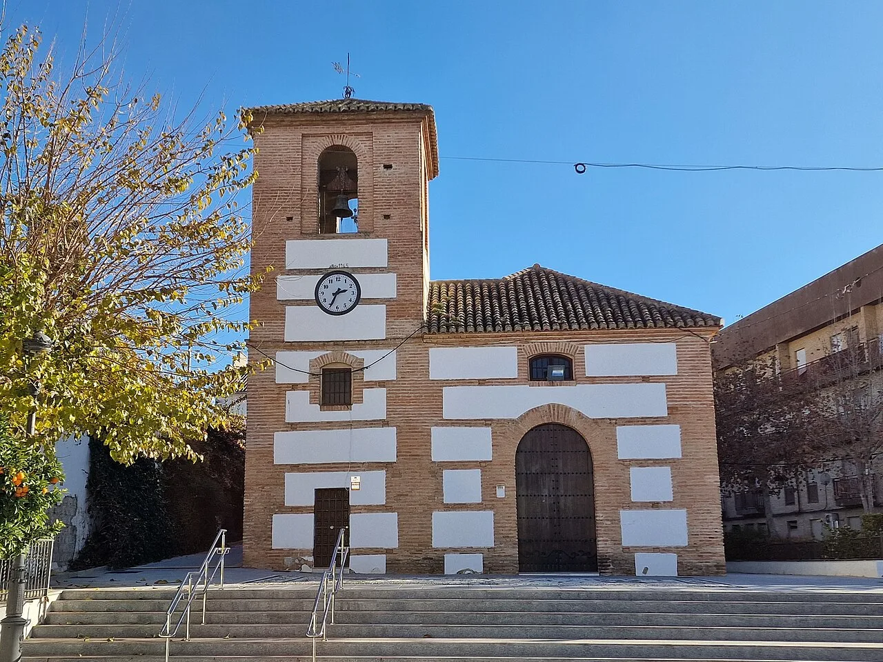 Vista de la Iglesia de la Inmaculada Concepción, en la localidad de Jun (provincia de Granada, España).