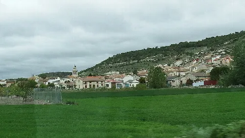 Landscape with lagoon, houses, and hills in Segovia, Spain.