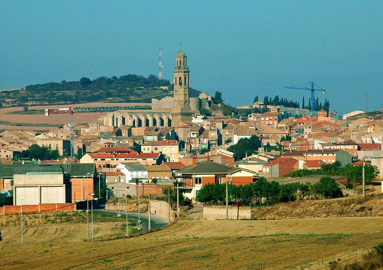 View of Calaf with church and houses in an urban landscape.