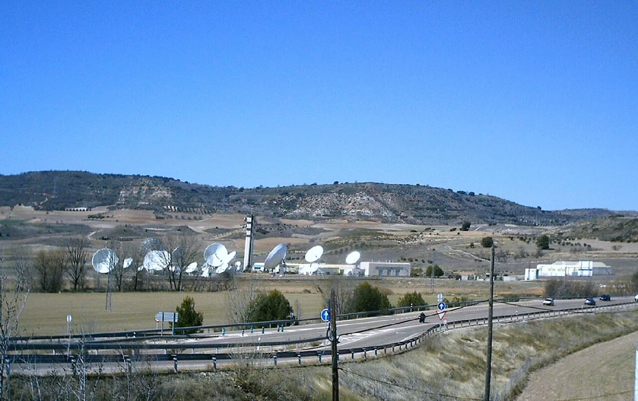Parabolic antennas and satellites in a field in Armuña de Tajuña.