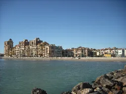 Buildings along the sea in Port Saplaya seen from the promenade
