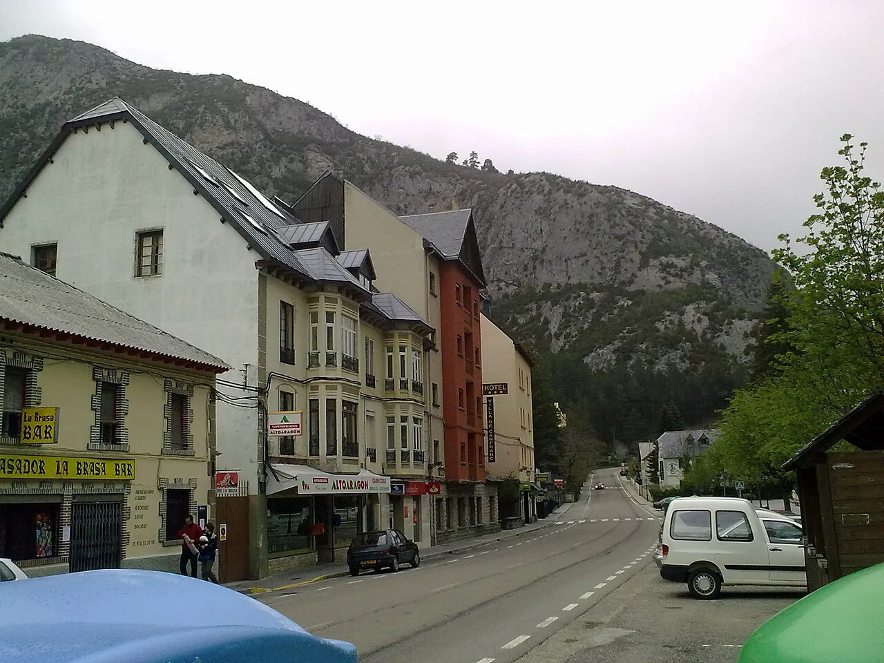 Street view of Canfranc with buildings and mountains.