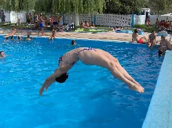Diving person in the public pool of Almargen, Málaga.