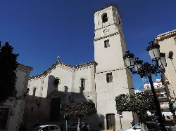 Sorbas parish church with tower and clock in the center.