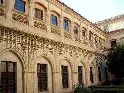 Cloister with arches and windows at the Segovia monastery.